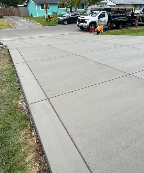 Broom finish driveway and decorate borders in Federal Way 